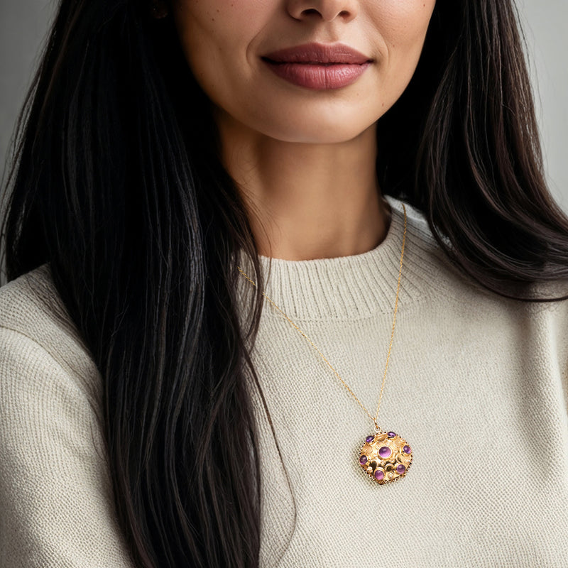 Amethyst cabochon disc pendant necklace in 18kt yellow gold worn on a gold chain