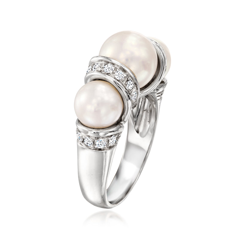 Cultured pearl and diamond ring in polished white gold, side pearls with prong settings