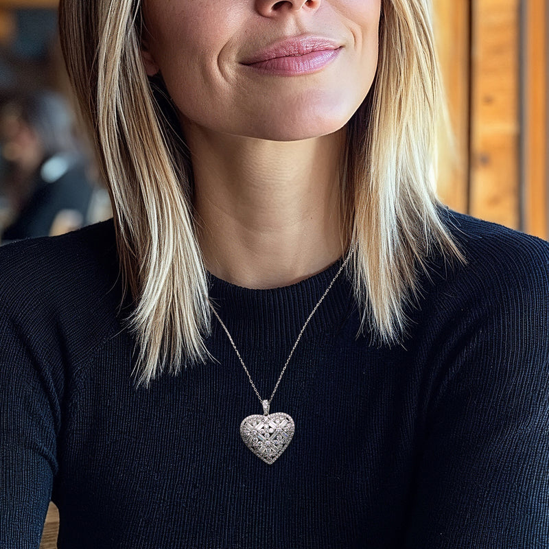 Sterling silver CZ heart pendant necklace worn on a fine chain