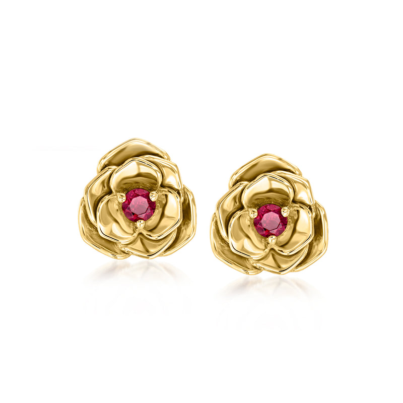 Gold-tone flower stud earrings with red center gemstones, post style.