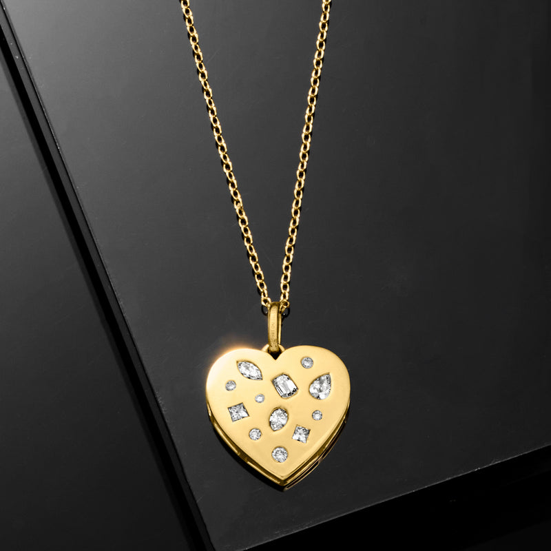 Gold heart pendant necklace with diamond-look stones on a delicate chain