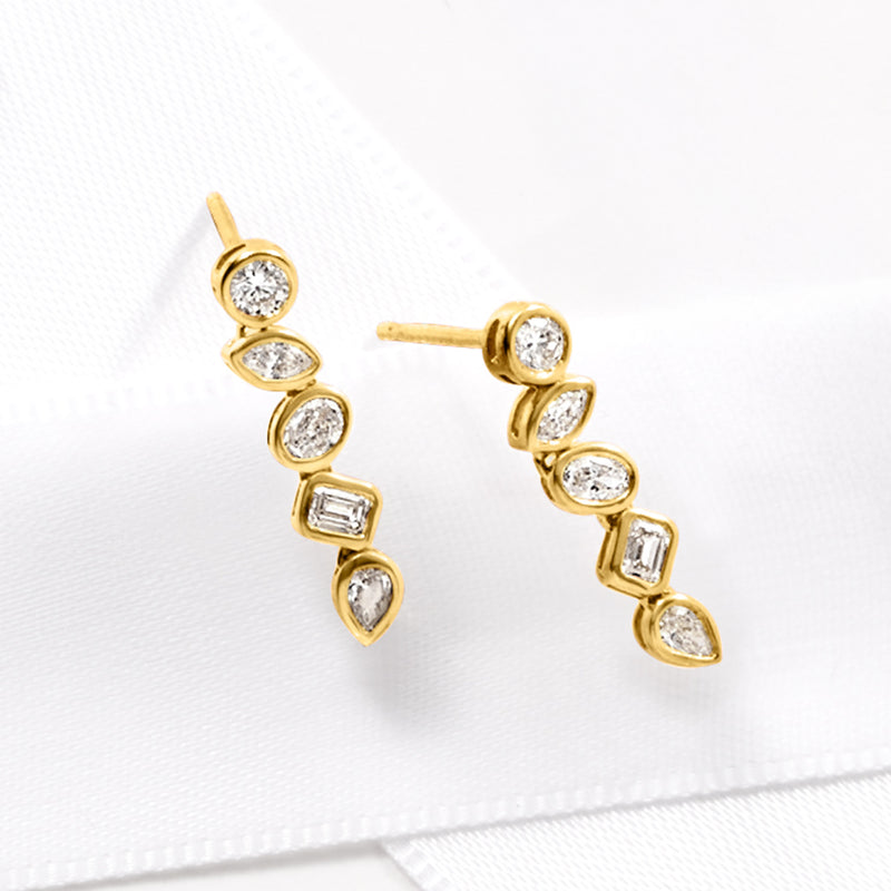 Gold bezel-set diamond drop post earrings, linear stones with a baguette accent