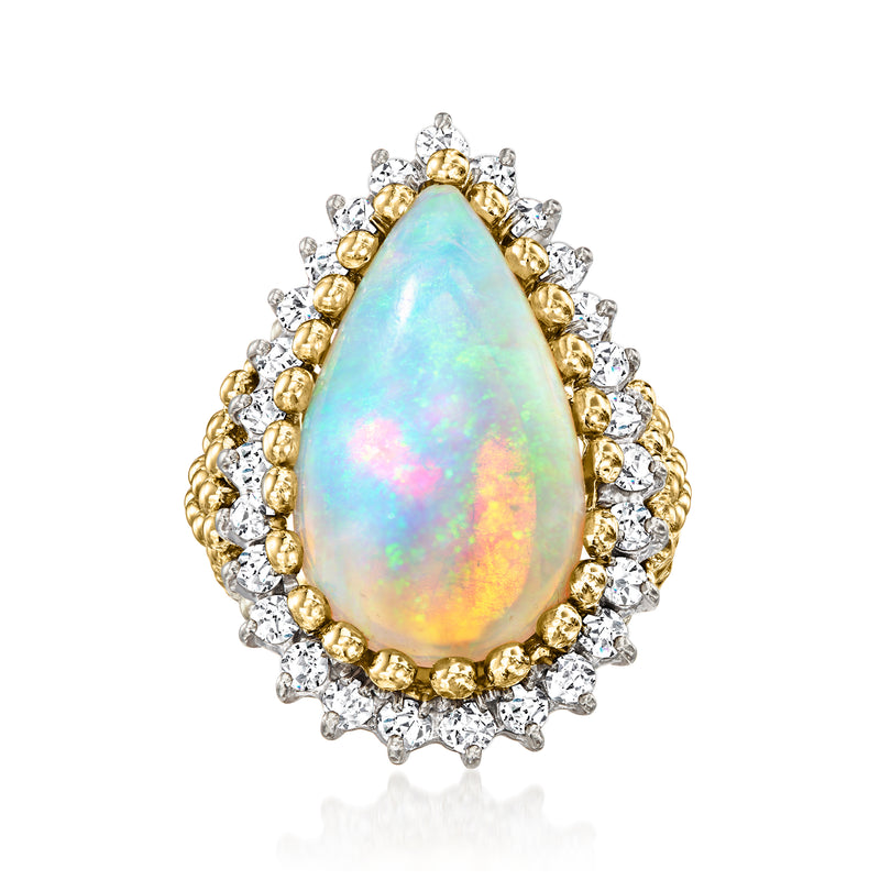 Vintage teardrop opal ring in 18kt yellow gold with round diamonds, prong-set