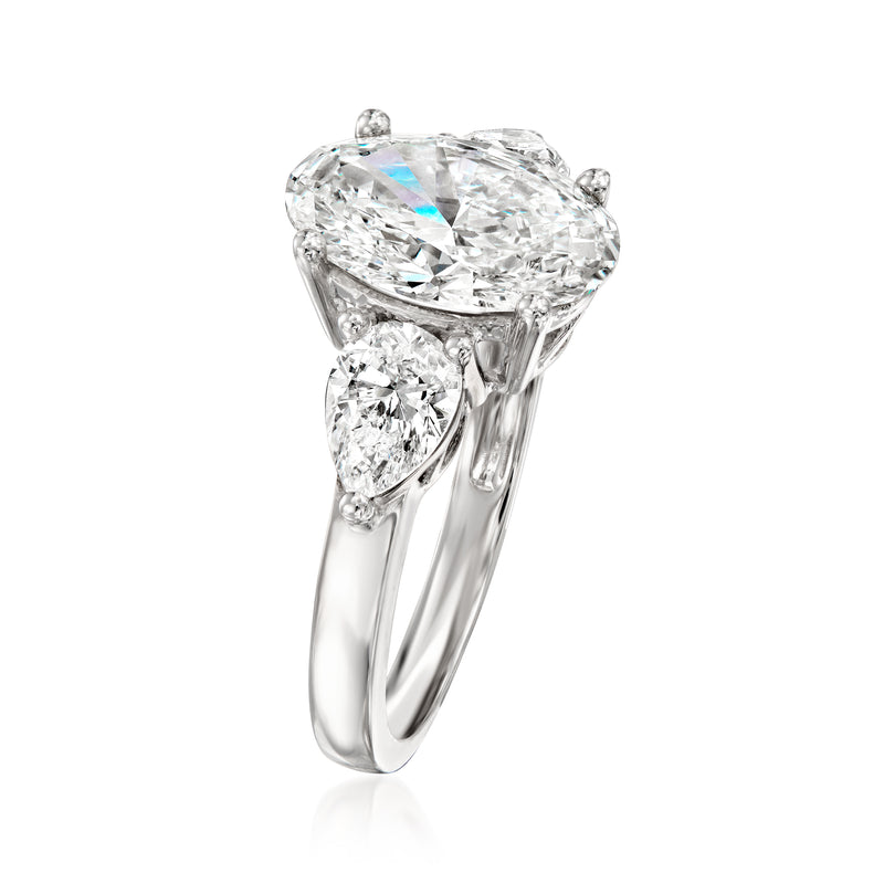 Lab-grown diamond ring in 14kt white gold, side view of pear-shaped center and accents