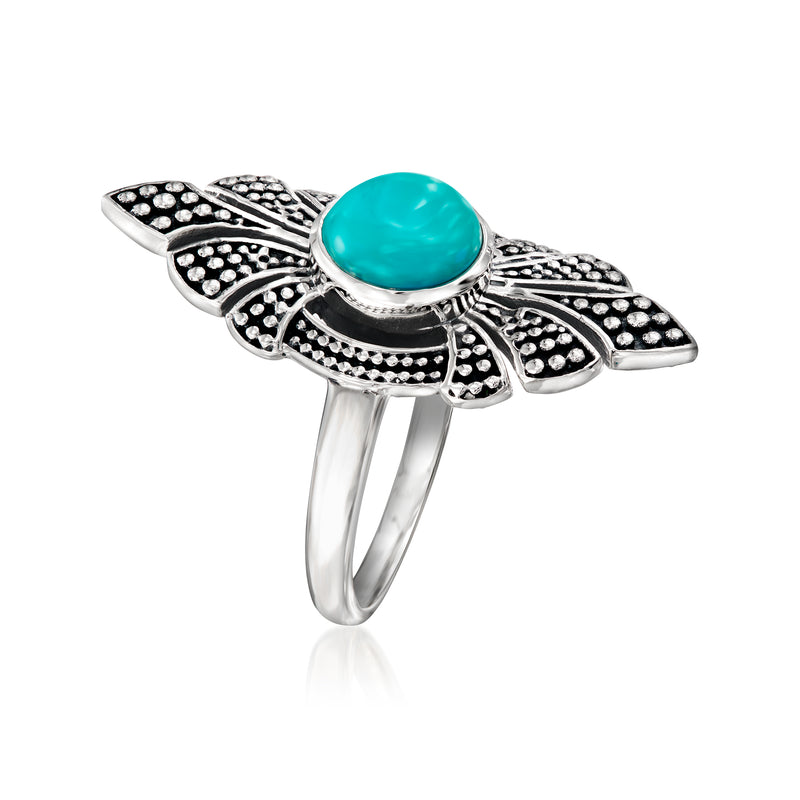 Sterling silver ring with turquoise oval center stone and marquise cutout sides