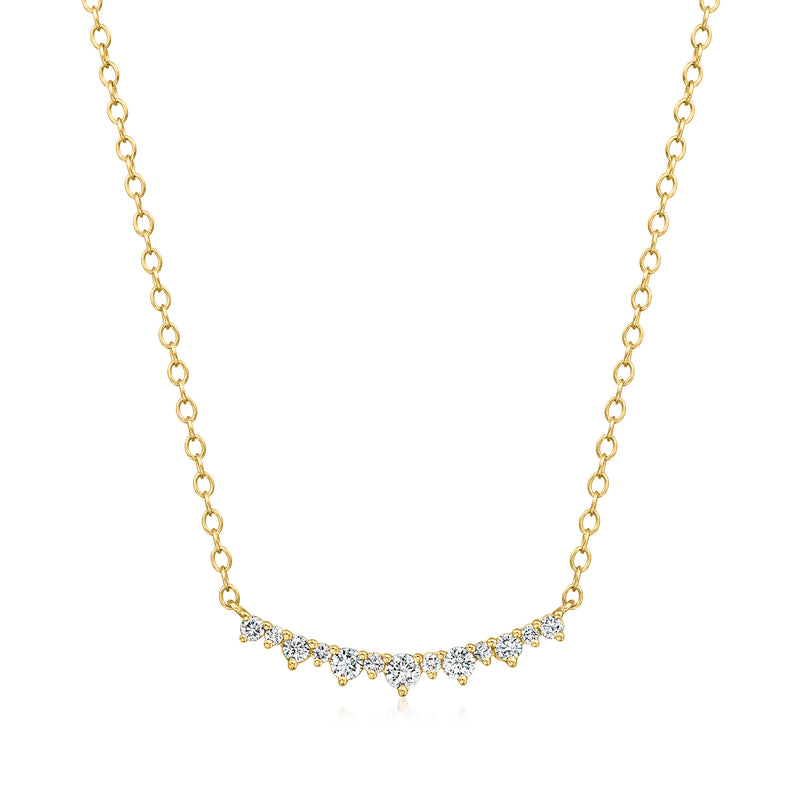 Gold vermeil curved bar necklace with small diamond accents along the arc