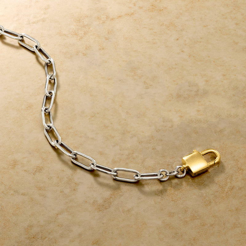 Sterling silver chain bracelet with gold padlock clasp at end link