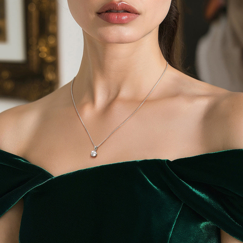 Platinum solitaire diamond necklace on a fine chain with small round pendant