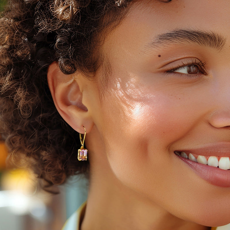 Gold leverback drop earrings with small rectangular ametrine stones, purple-yellow.