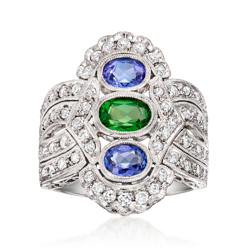 Platinum cocktail ring with oval blue and green gemstones, surrounded by white diamonds