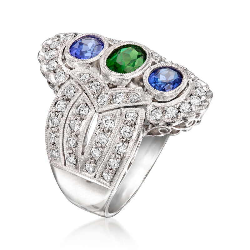Platinum cocktail ring with blue and green round gemstones and white diamond cluster details