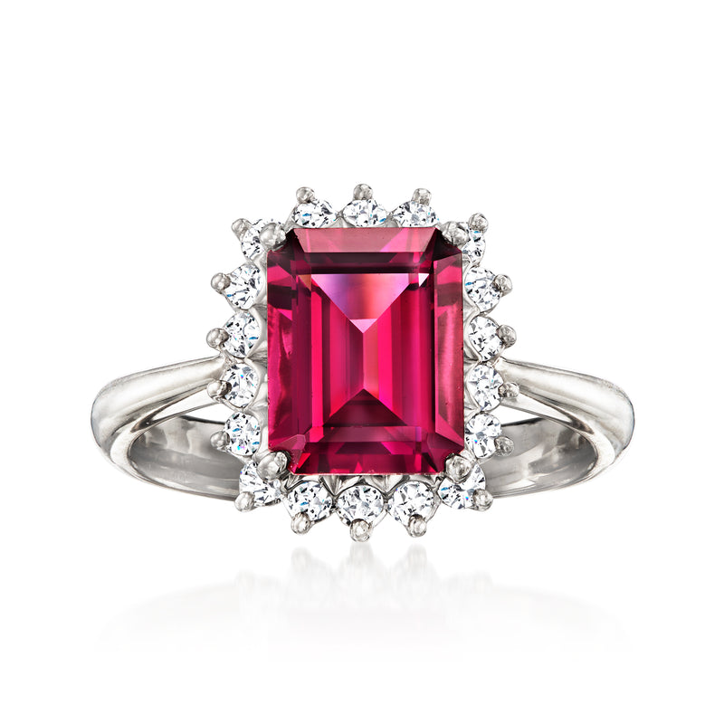 Platinum ring with rectangular rhodolite garnet center and halo of round diamonds