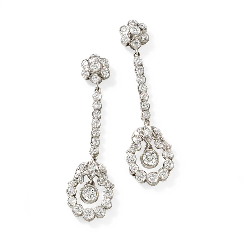Platinum diamond drop earrings with round halo dangles and a vertical beaded row