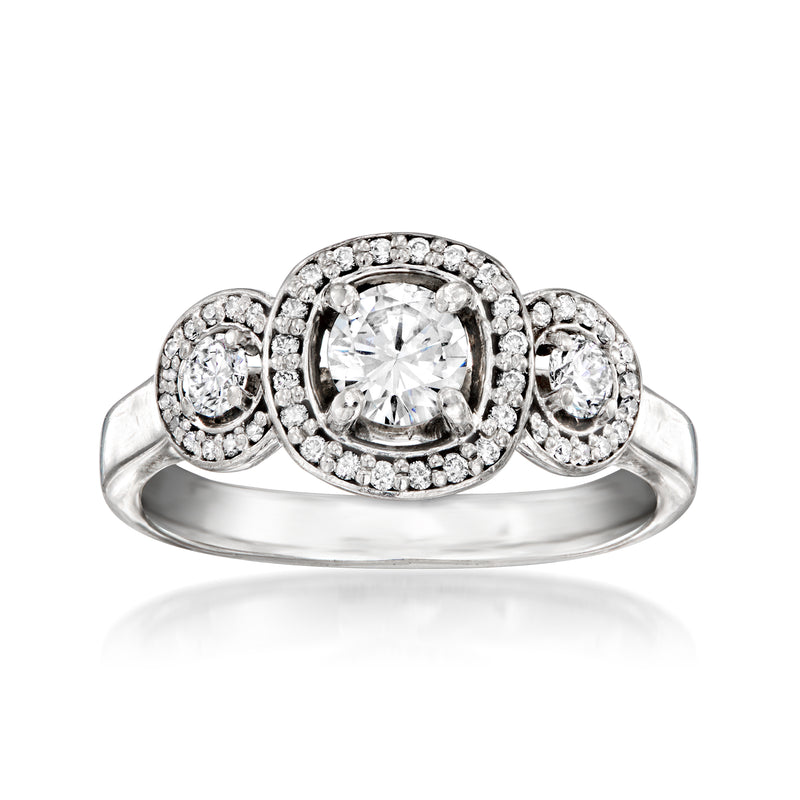 Platinum diamond ring with center round stone and two side halo diamonds