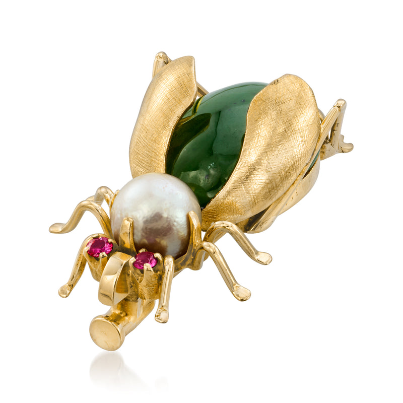 Gold bug pin detail: green oval stone, white pearl, pink gems, antenna and legs