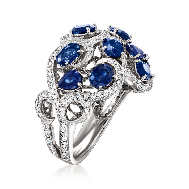 Sapphire and diamond swirl ring with multiple oval blue stones in white setting