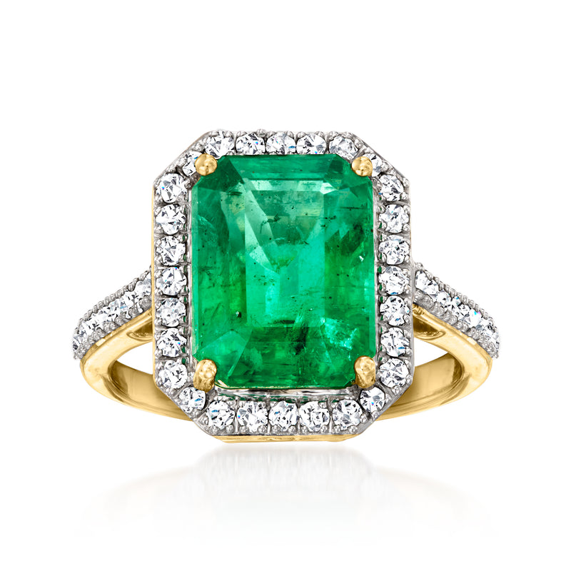 18k yellow gold ring with emerald-cut green emerald and diamond halo
