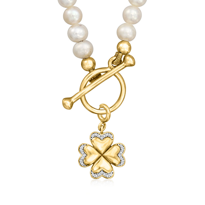 Cultured pearl toggle necklace with gold floral pendant and white pearl strand.