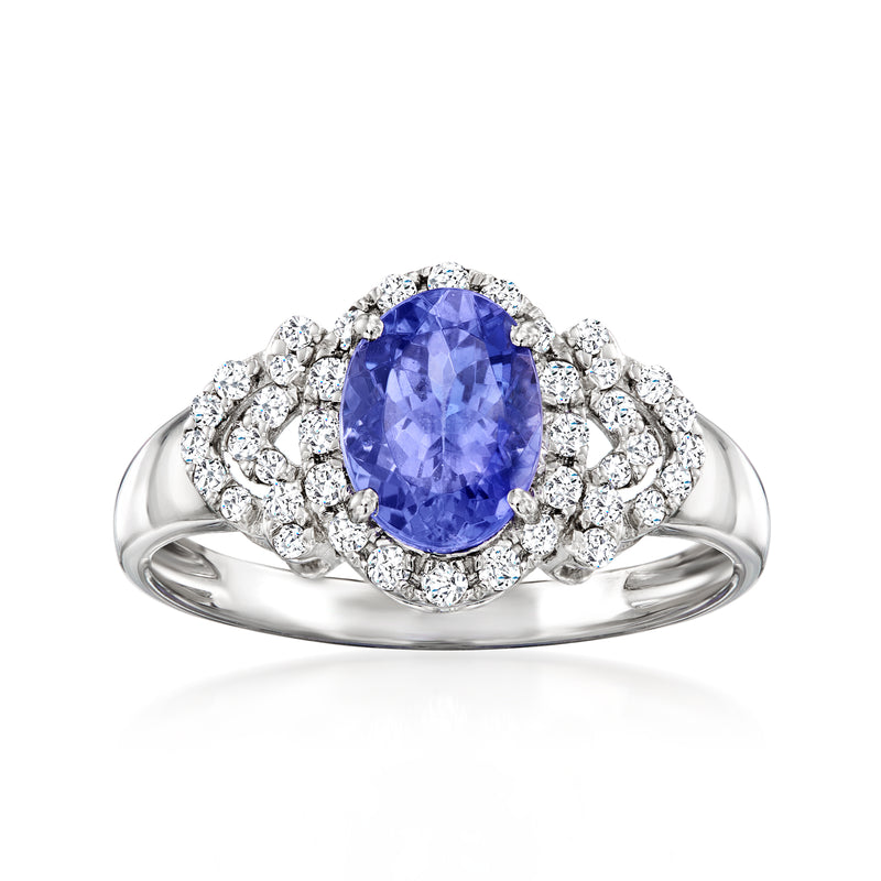 Platinum ring with oval tanzanite and diamond halo setting