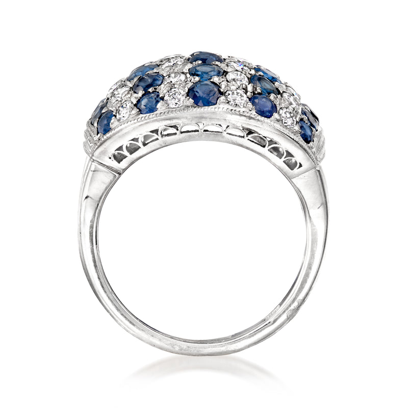 Platinum band with scalloped edge, blue sapphire and diamond halo on dome top