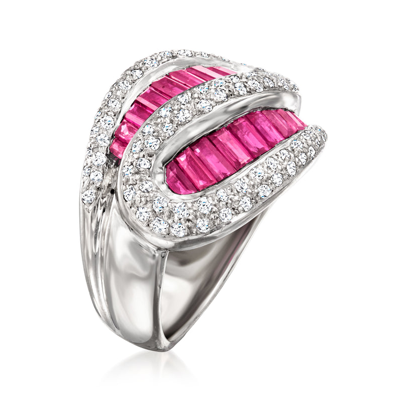 Platinum ring featuring ruby baguette stones with diamond-set swirl detailing
