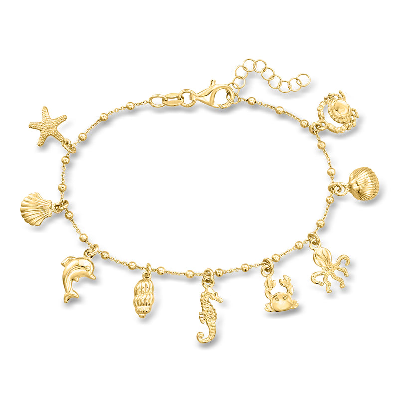 Gold over sterling sea life charm bracelet with dolphins, seahorses, starfish and shells