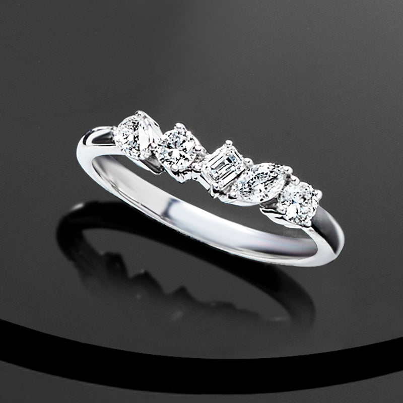 Sterling silver diamond ring with five multi-shaped lab-grown stones, angled view