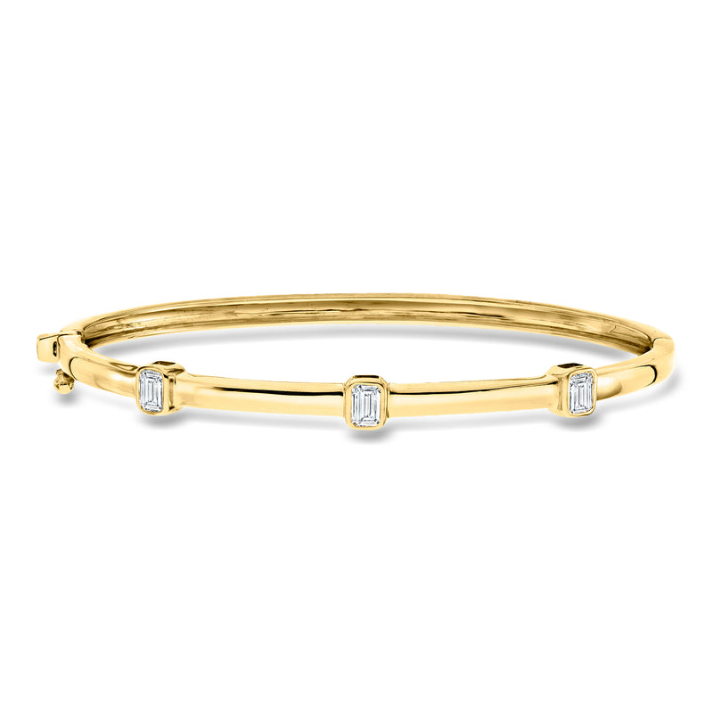 18kt gold over sterling bangle bracelet with three emerald-cut lab diamond stations