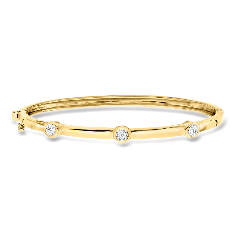 Gold station bangle bracelet with four round lab-grown diamond accents