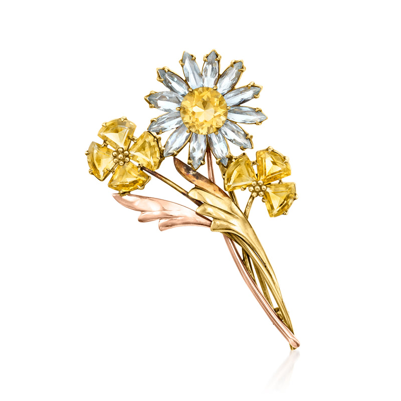 Two-tone gold flower pin with citrine and aquamarine glass stones, detailed petals