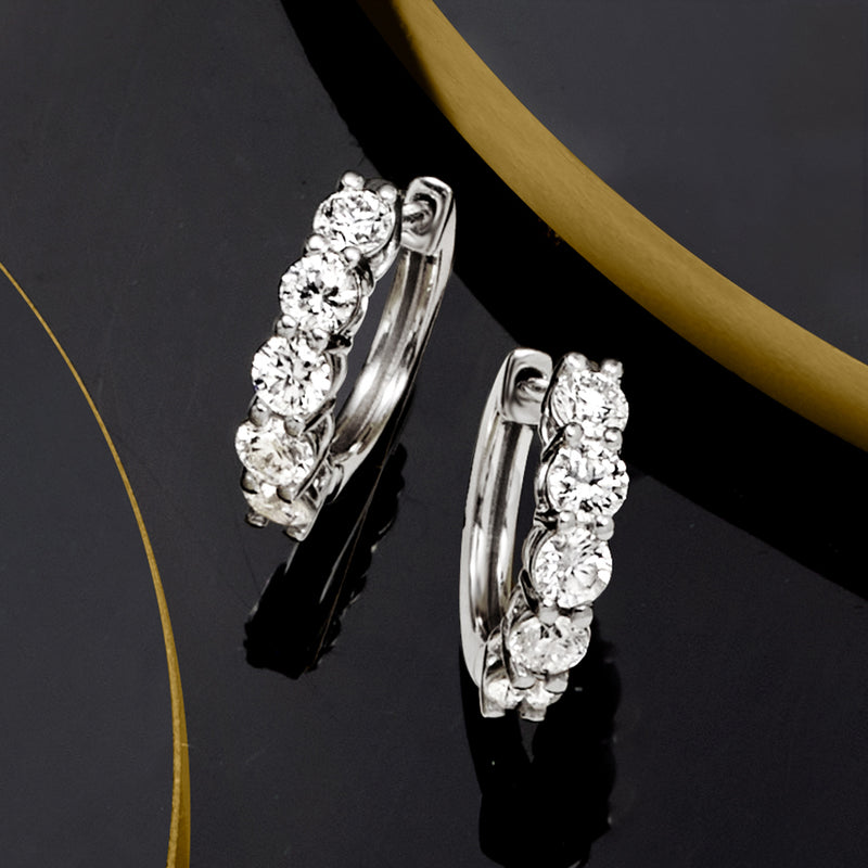 Five-stone platinum hoop earrings with five round diamonds, side view