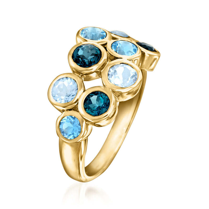 Gold over sterling bubble ring with blue topaz in round raised settings