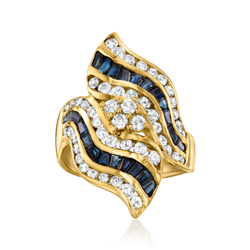 18kt yellow gold wave ring with dark blue sapphire bands and diamond accents