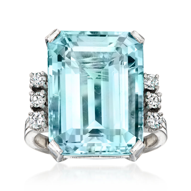 Emerald-cut aquamarine ring with round diamond side stones, 18kt white gold