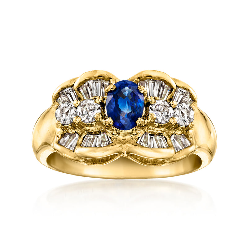 Yellow gold vintage ring with oval blue sapphire center and white diamond surround