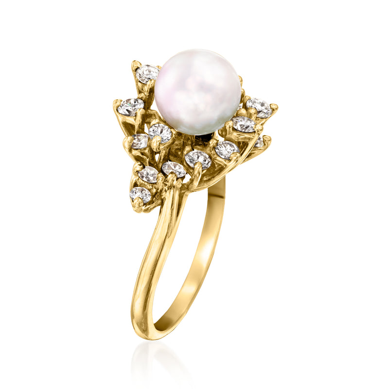 14kt yellow gold ring featuring a round cultured pearl center with prong-set diamonds
