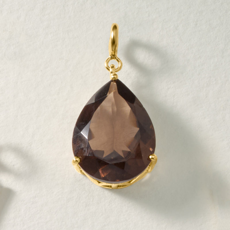 Gold-tone smoky quartz teardrop charm pendant with faceted stone and top loop