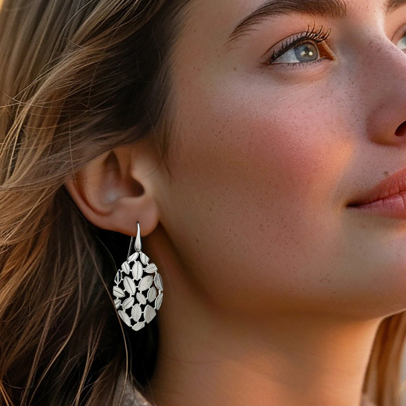Sterling silver leaf cluster drop earrings with oval leaf details and earwire.