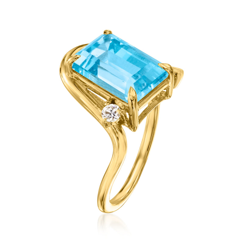 Gold-tone ring with cushion-cut blue topaz center and round diamond side accents