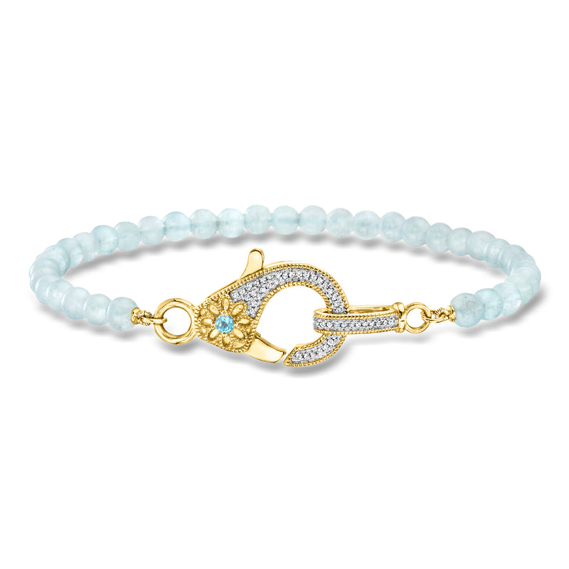 Gold-toned aquamarine bead bracelet with lobster clasp and blue gemstone, diamond accents