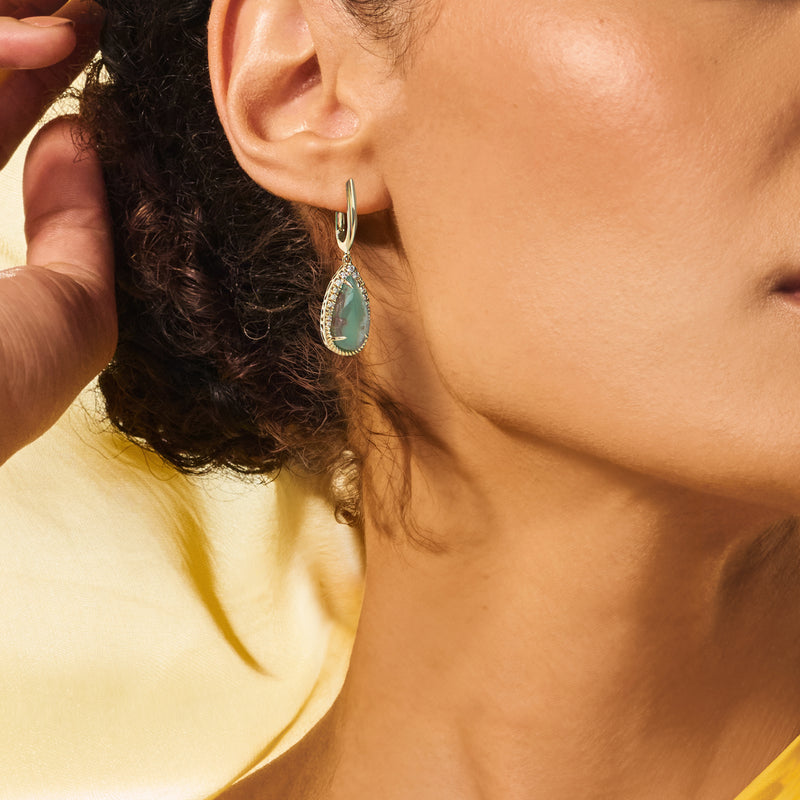 Honey gold hoop drop earrings with green teardrop chalcedony and diamond details on ear