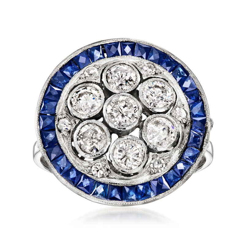 Vintage platinum circle ring with blue sapphire halo and round diamond accents