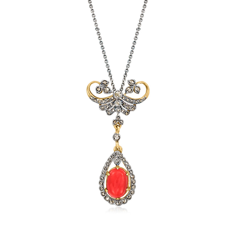 Vintage pendant necklace with red oval coral drop and diamond accents in gold and silver.