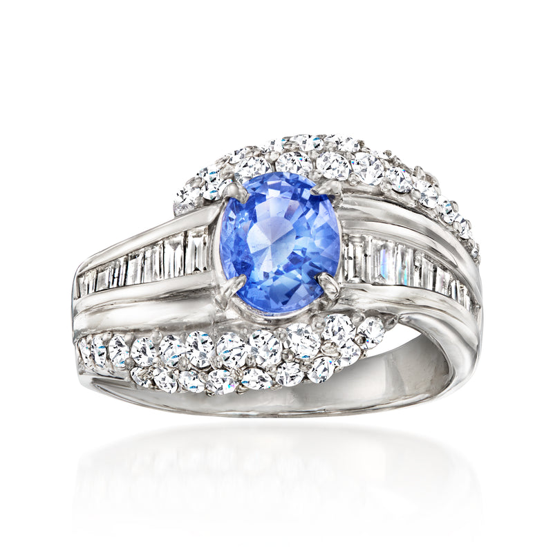 Vintage platinum sapphire ring with oval blue sapphire and diamond accents