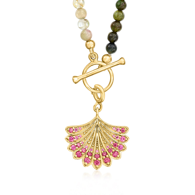 Tourmaline bead necklace with gold toggle clasp and pink jeweled fan charm detail.