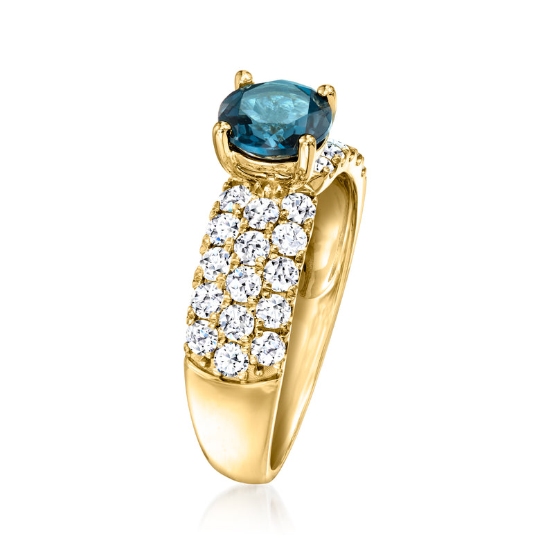 14kt yellow gold ring with London blue topaz oval gemstone and diamond side cluster