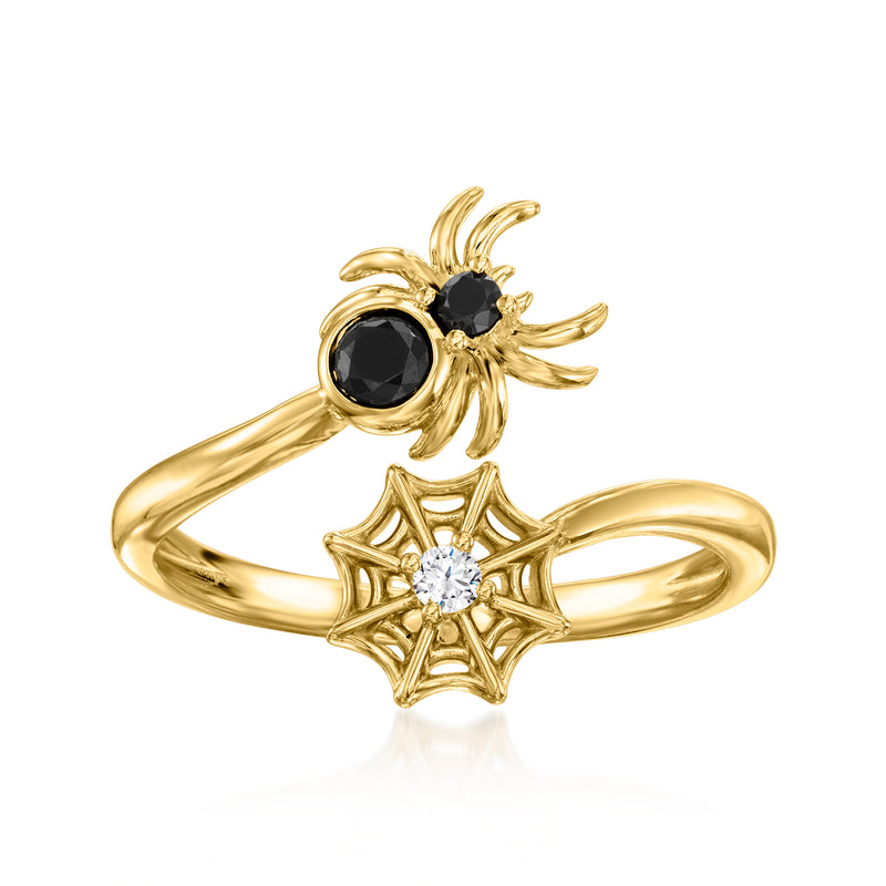 Gold spider bypass ring with black stone center and round diamond, web motif