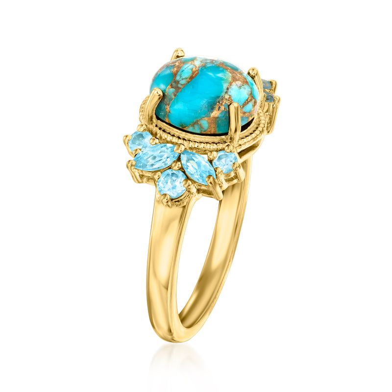 Gold ring with oval turquoise gemstone centerpiece and light blue marquise side stones