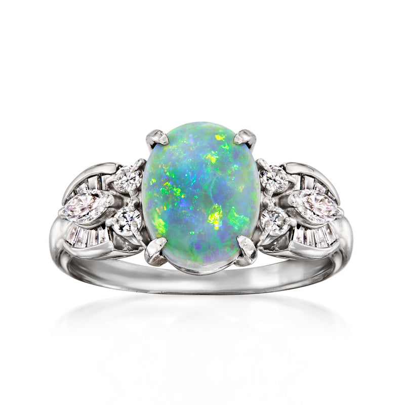 Opal and diamond platinum ring with oval opal center and side diamond clusters