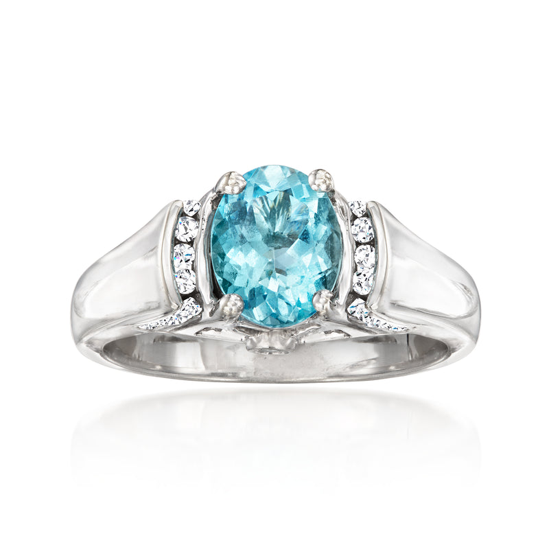 Aquamarine oval gemstone ring in 14kt white gold with diamond side stones